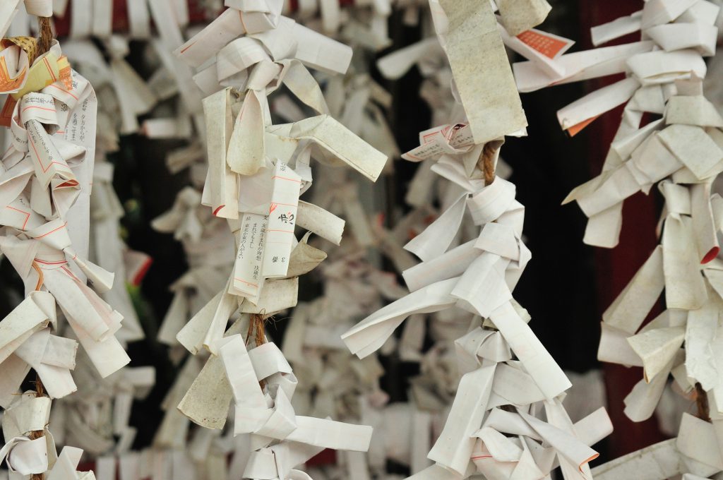 Opened Omikuji Tied to a Shrine